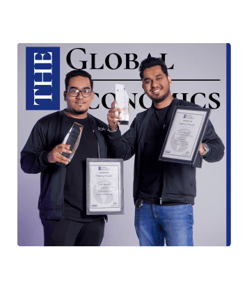 Leaders at FundedNext Posing in Front of The Global Economics Sign Holding Awards
